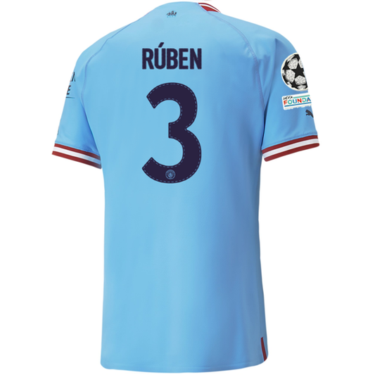 Puma Manchester City Authentic Ruben Dias Home Jersey w/ Champions League Patches 22/23 (Team Light Blue/Intense Red)